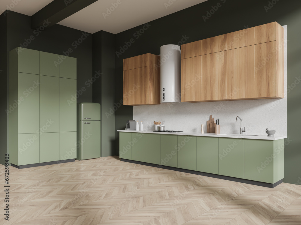 Wooden and green kitchen corner with cabinets and fridge