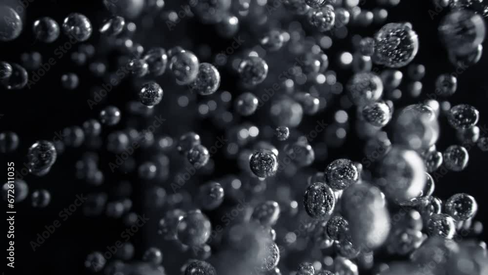 Super Slow Motion Macro Shot of Various Bubbles Rising up Towards Camera on Black at 1000fps. Super Slow Motion Macro Shot of Various Bubbles Rising up Towards Camera on Black at 1000fps.