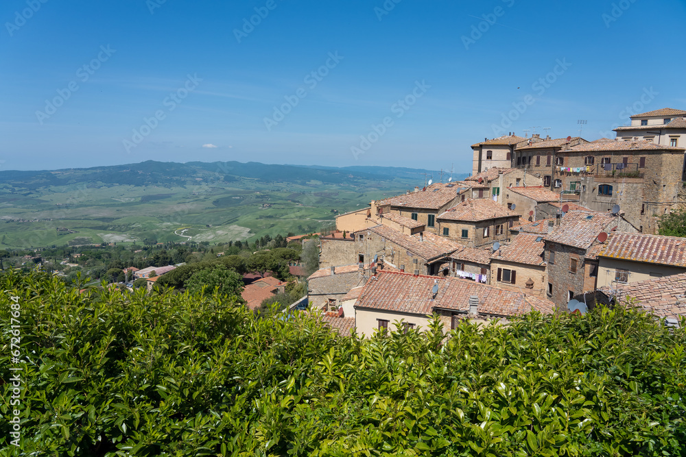 view over rooftops of a Spanish hillside village to open countryside