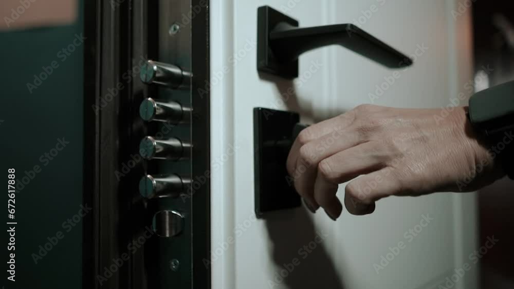 a master installs doors to an apartment in a house, door handle fittings close-up a master installs doors to an apartment in a house, door handle fittings close-up