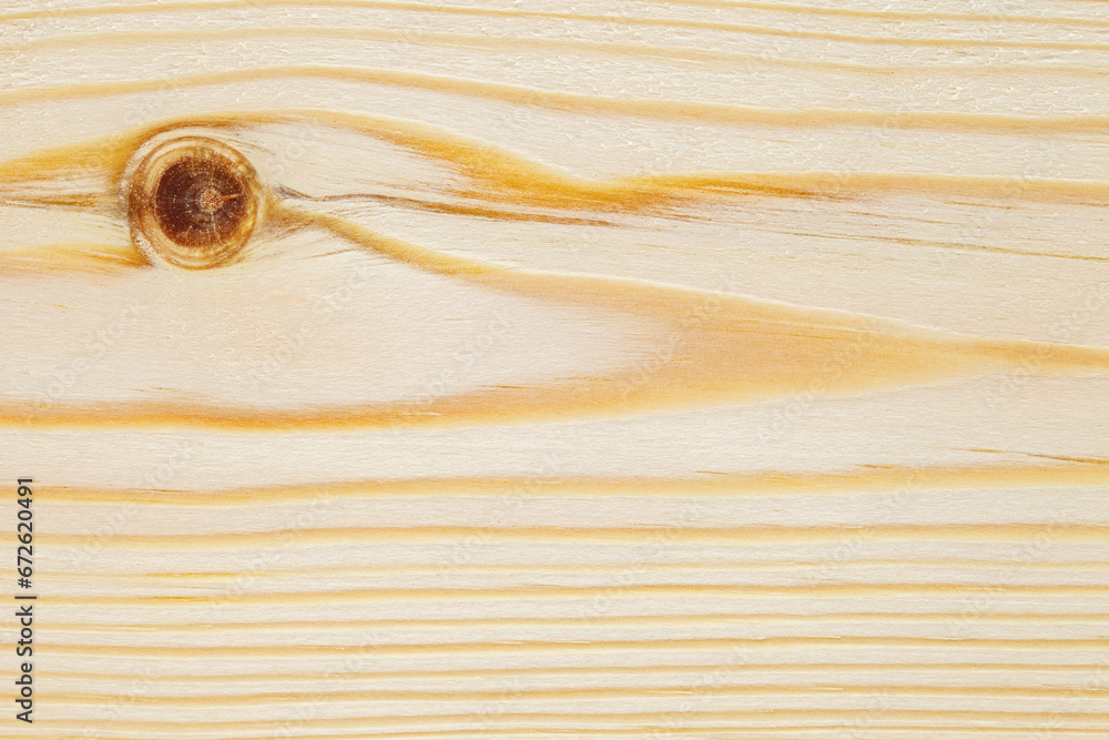 Surface of wooden board with round brown traces of twigs, close-up, background