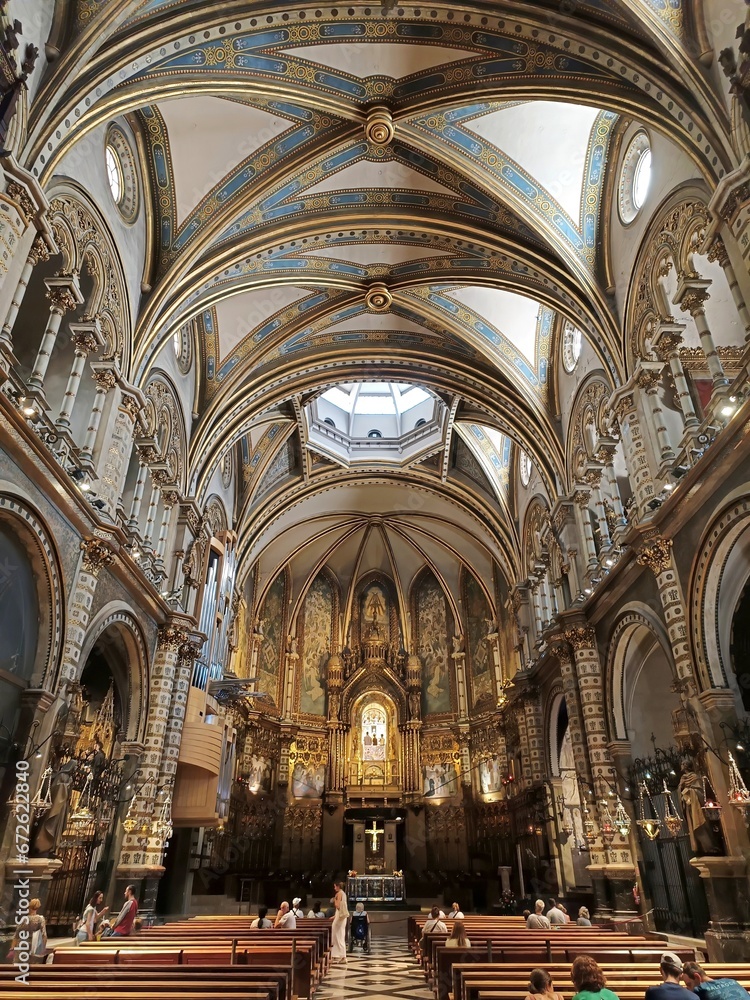 The central nave and altar of the Basilica of Montserrat, Spain