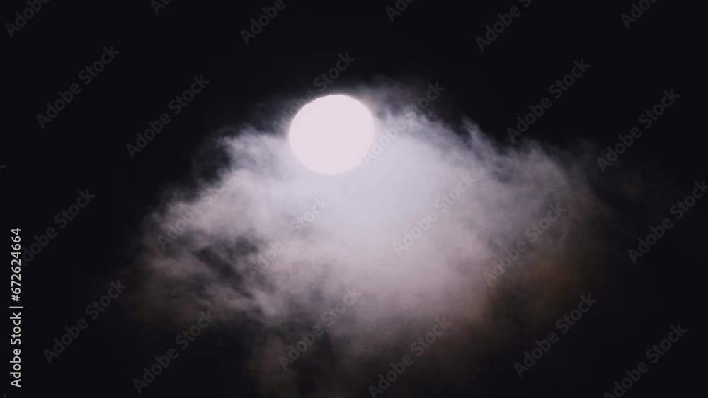 Waning gibbous moon at 92 percent illuminated with clouds drifting past in the dark night sky over Woy Woy, NSW, Australia Waning gibbous moon at 92 percent illuminated with clouds drifting past in the dark night sky over Woy Woy, NSW, Australia