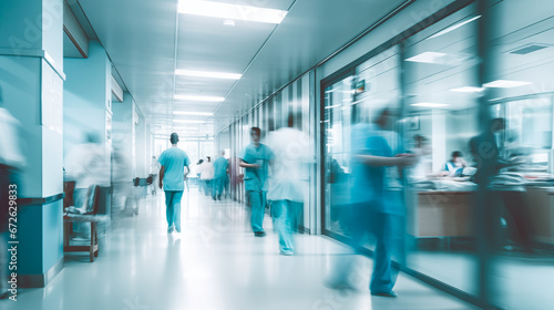 Blurred image of doctors walking along a hospital corridor, abstract background