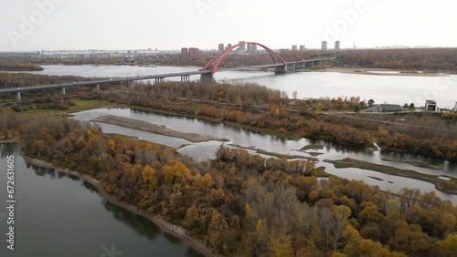 Autumn landscape of the large road bridge. Aerial view of Novosibirsk Bugrinsky Bridge. photo