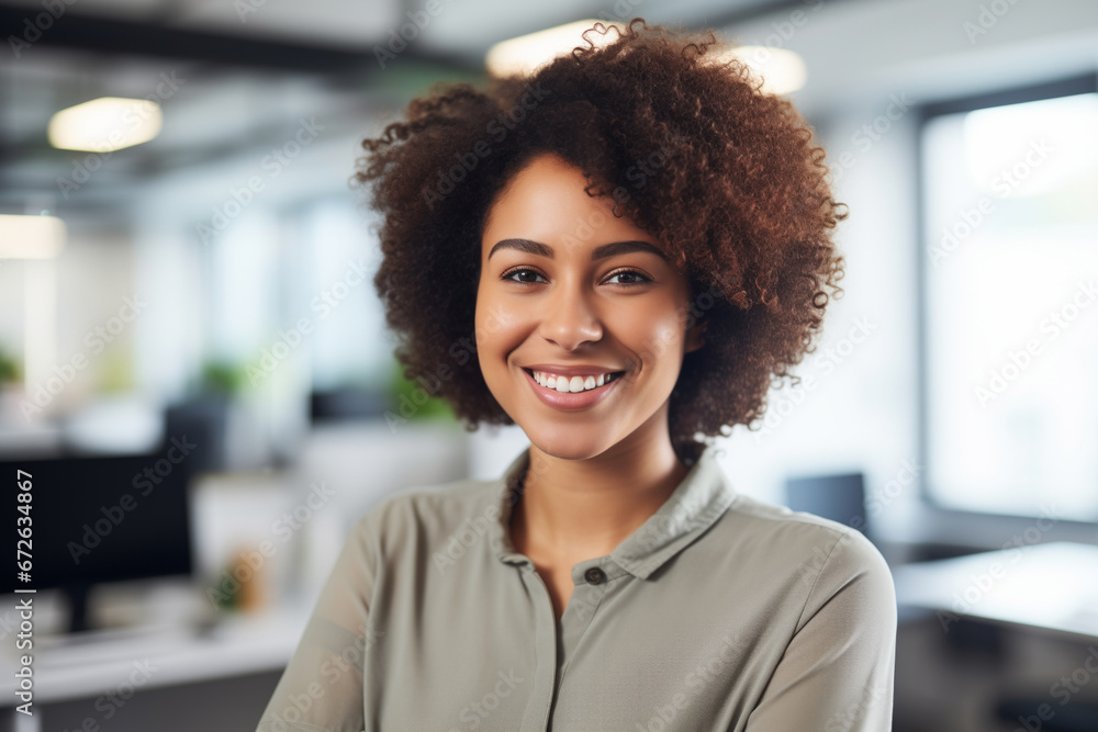 Portrait of a smiling young African-American woman in the office. Portrait of a smiling young African-American woman in the office.
