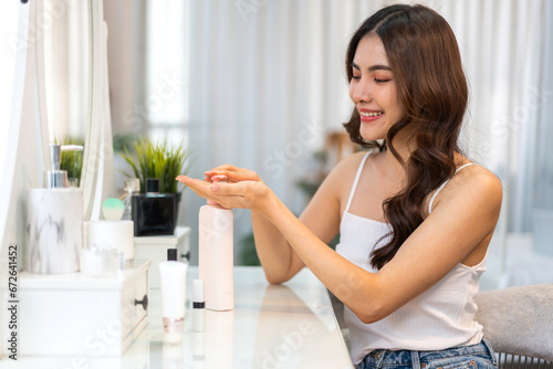 Smiling of beautiful asian woman fresh healthy white skin, clean, moisturizer.asian girl touching on hand applying lotion cream, skincare, cosmetics, cosmetology, beauty, fashion at home.spa, wellness