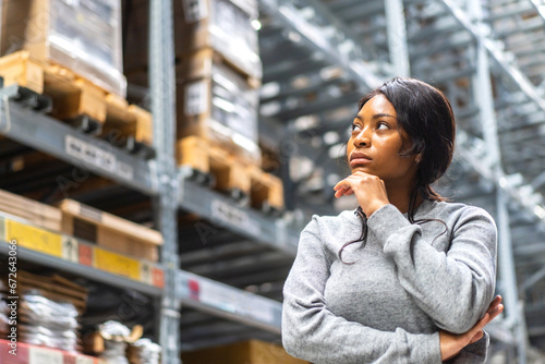 Portrait african american engineer woman shipping order detail export and import,goods,factory,warehouse,international trade,transportation,cargo ship,logistic,distribution.business industry © Art_Photo