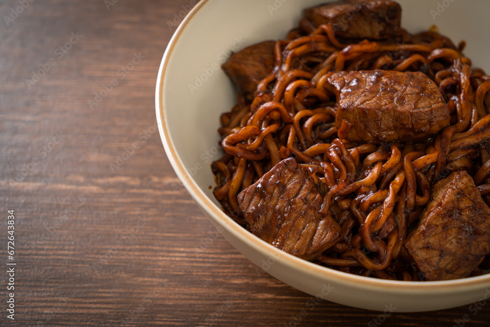 Obraz premium Jjapaguri or Chapaguri, Korean Black Beans Spicy Noodles with Beef