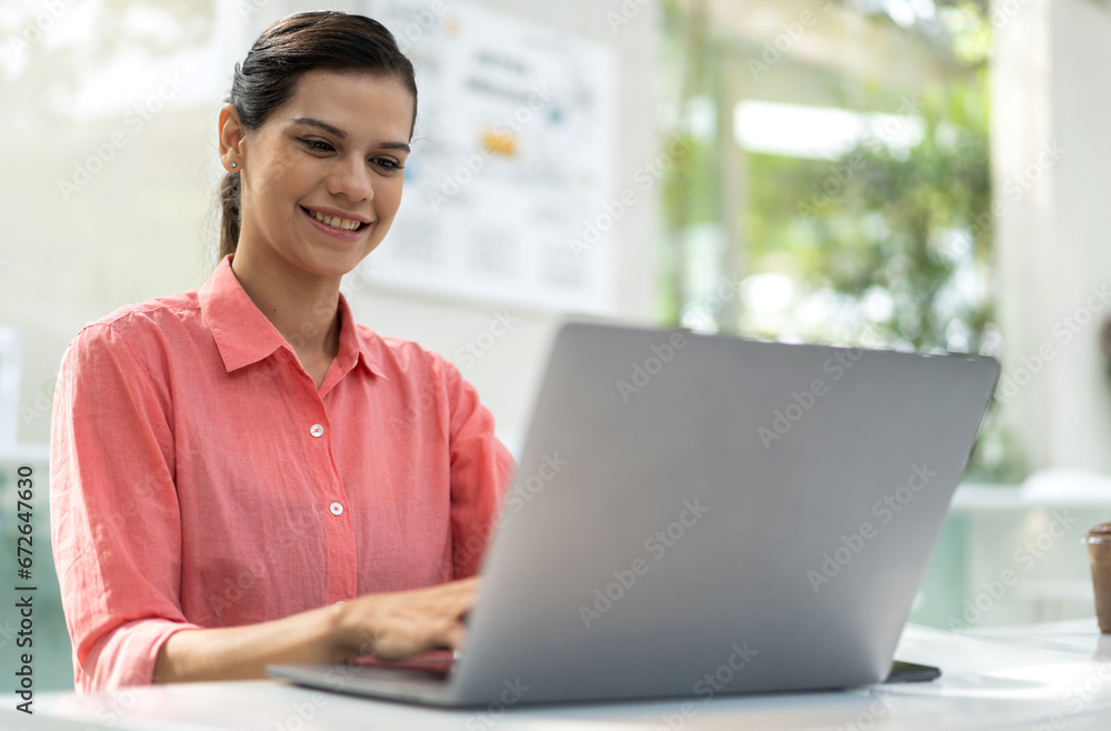 Portrait of smiling happy beautiful woman relax using technology of laptop computer sitting on chair.Young hipster creative girl freelancer business thinking with new idea content in cafe Portrait of smiling happy beautiful woman relax using technology of laptop computer sitting on chair.Young hipster creative girl freelancer business thinking with new idea content in cafe