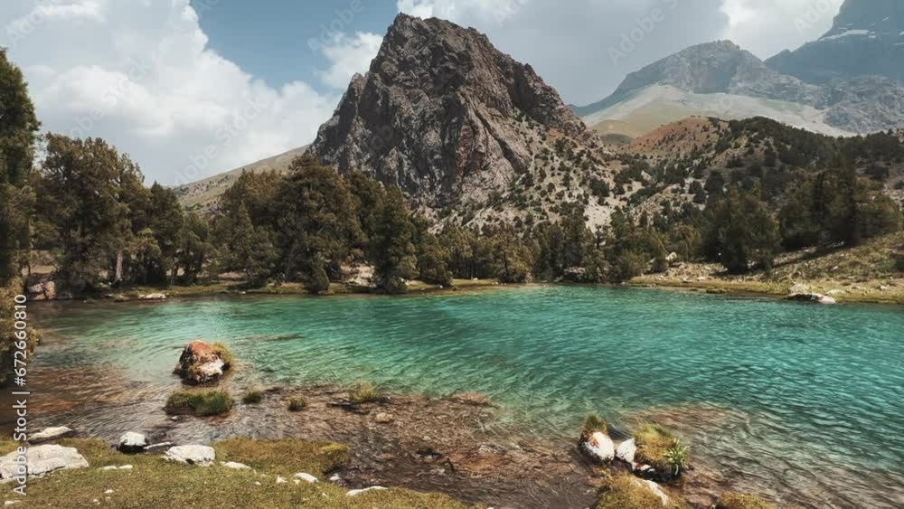 The Alaudin (Chapdara) lakes, lying at an altitude of 2800 m, are considered one of the most beautiful lakes of the Fan Mountains. Turquoise mountain lake. Pamiro-Alai. Tajikistan, Pamir 4K The Alaudin (Chapdara) lakes, lying at an altitude of 2800 m, are considered one of the most beautiful lakes of the Fan Mountains. Turquoise mountain lake. Pamiro-Alai. Tajikistan, Pamir 4K