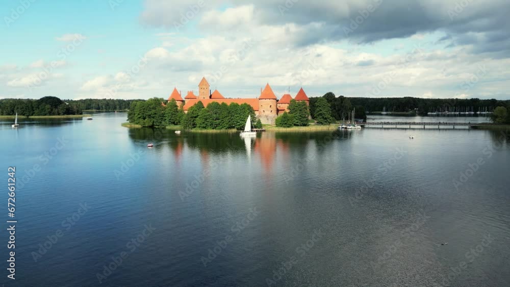 Aerial drone shot of red brick medieval castle on island in Trakai, Vilnius region, Lithuania. Trakai castle medieval gothic Island castle located in Galve lake. Most beautiful Lithuanian landmark Aerial drone shot of red brick medieval castle on island in Trakai, Vilnius region, Lithuania. Trakai castle medieval gothic Island castle located in Galve lake. Most beautiful Lithuanian landmark