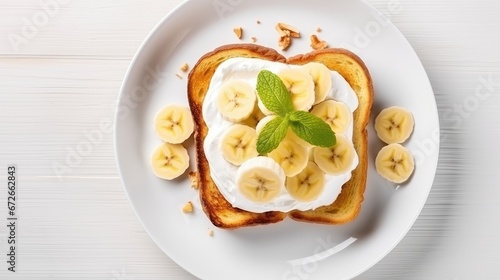 High angle of French Toast with Bananas on white wooden board. 