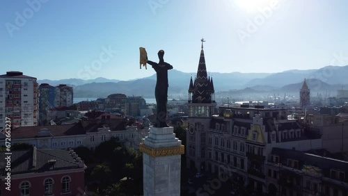 Aerial silhouette of the Medea and the Golden Fleece monument on Europe Square in Batumi, Georgia. photo