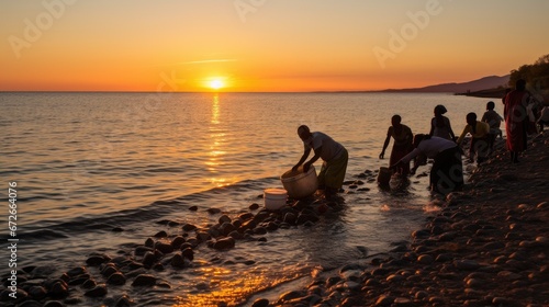 People collecting water from Lake Tanganyika in Reumonge  Burundi circa. 