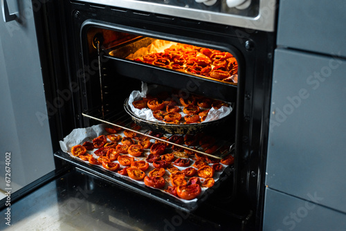 Cooking sun-dried tomatoes in the oven in the kitchen