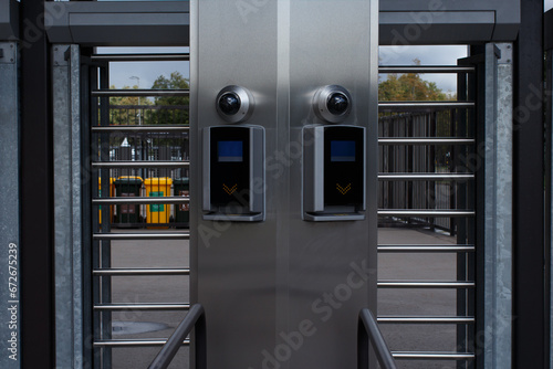 Metal structure for stadium access with ticket scanner and video surveillance camera. photo