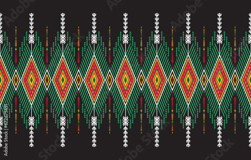 Mexican indian design with tribal ethnic themes on a geometric seamless background Beautiful textile print with native American tribal elements in an ethnic traditional style. Folk fashion from Mexico