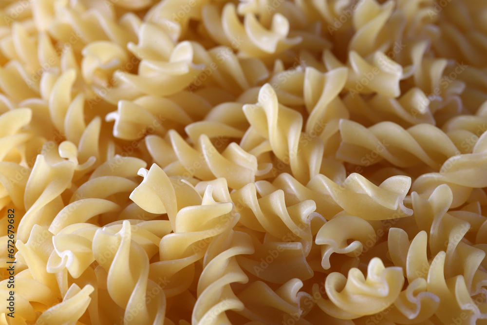 Close up image of beige lentil fusilli pasta Close up image of beige lentil fusilli pasta