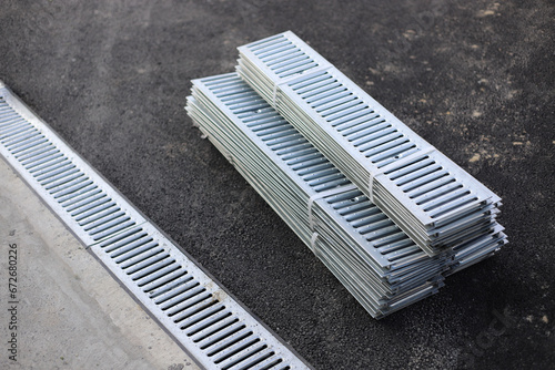 Metal landscape trench rain water drain system in a public area