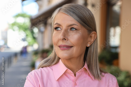 Portrait of beautiful happy senior woman outdoors