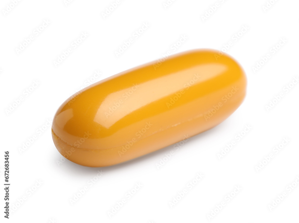 One orange pill on white background. Medicinal treatment