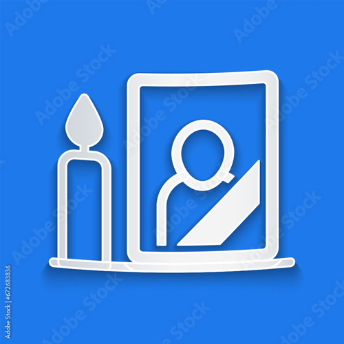 Paper cut Mourning photo frame with black ribbon icon isolated on blue background. Funeral ceremony and condolence card layout. Paper art style. Vector