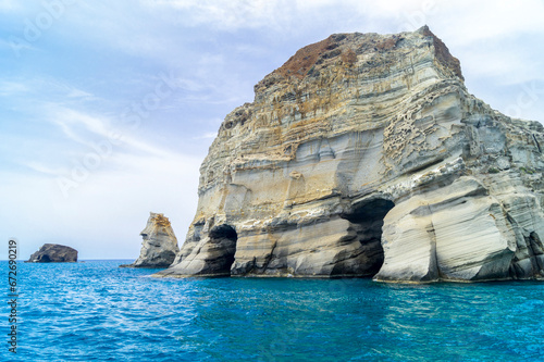 Caves and rock formations by the sea at Sarakiniko area in Milos island, Greece