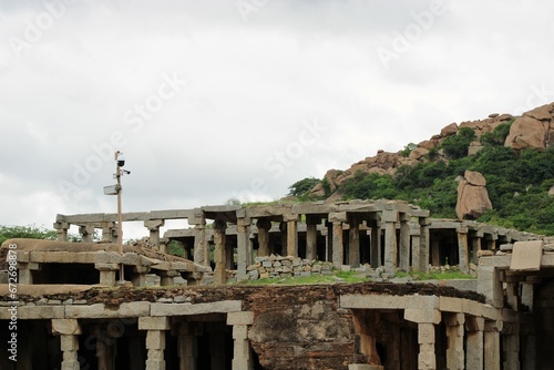 Hampi, Karnataka India - July 24 2023: Stone chariot at temple of Vijaya Vittala complex in desert valley of Hampi photo