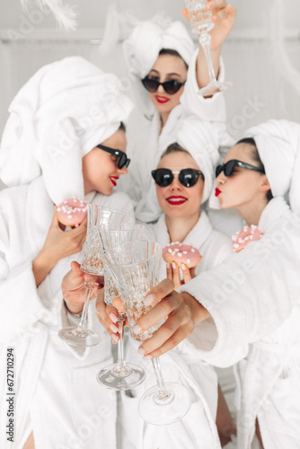 Sticker Young, beautiful women in bathrobes and glasses enjoying bachelorette party at s