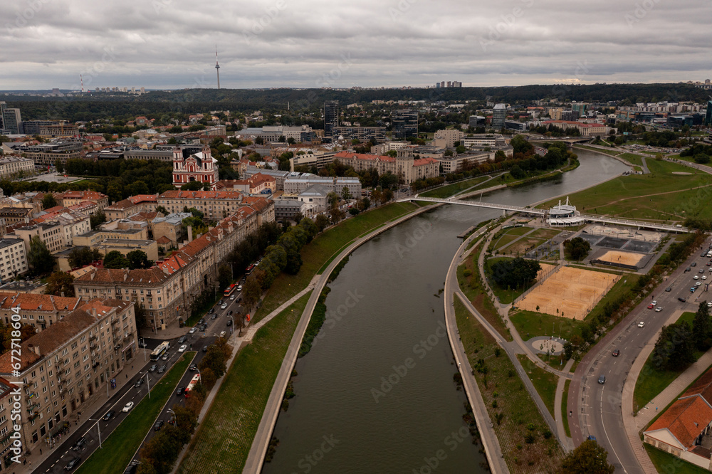 Drone photography of river and cityscape with parks and buildings