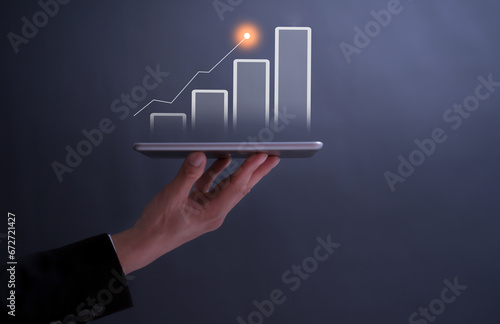 businessman typing and using on laptop holographic in the office workplace planing in work progress about investment and money management ,trading chart financial investment money management concept 