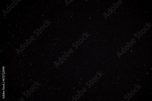 Astronomy photo of night starry sky background. Group of stars in the dark sky.