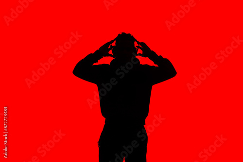 silhouette of a dj with headphones on