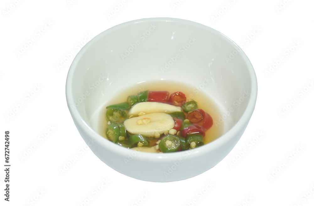 chop fresh chili and garlic in fish sauce with lime on cup chop fresh chili and garlic in fish sauce with lime on cup