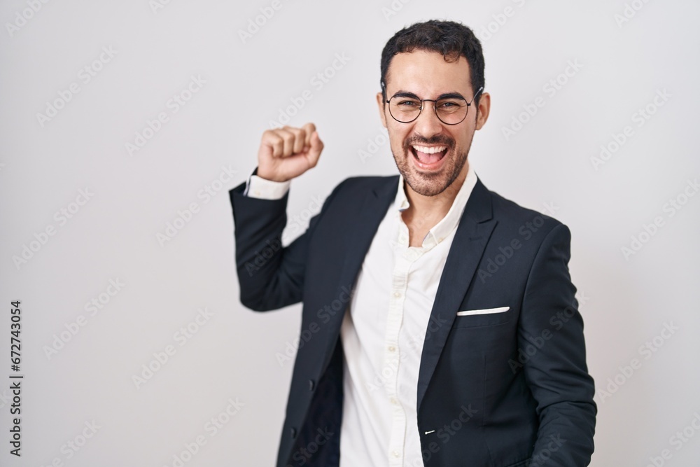 Handsome business hispanic man standing over white background dancing happy and cheerful, smiling moving casual and confident listening to music Handsome business hispanic man standing over white background dancing happy and cheerful, smiling moving casual and confident listening to music