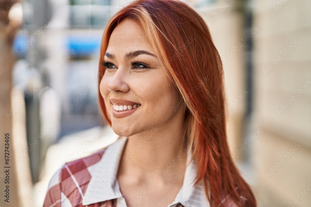 Young caucasian woman smiling confident looking to the side at street