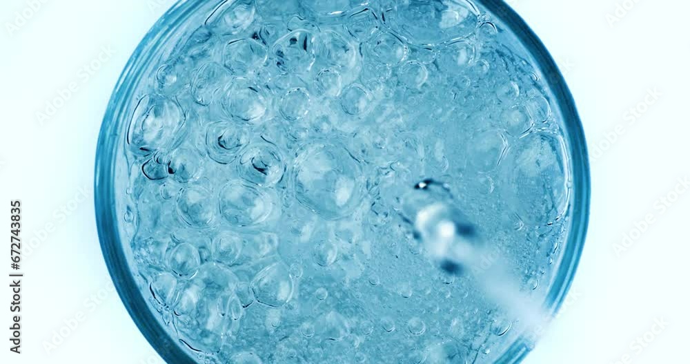 Pouring fresh pure sparkling water from bottle into a glass. Bubbles in water on super slow motion. Pouring fresh pure sparkling water from bottle into a glass. Bubbles in water on super slow motion.