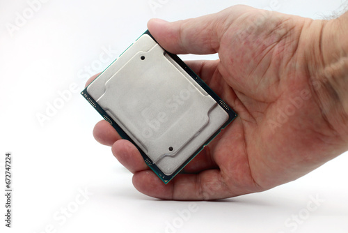 New generation server processor in hand on white background