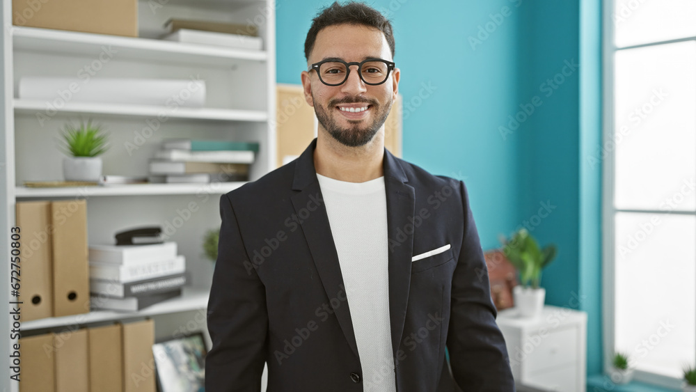 Young arab man business worker smiling confident at the office Young arab man business worker smiling confident at the office