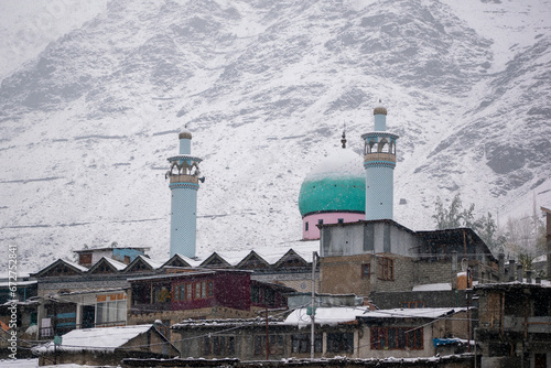 Stunning view of Jamia Masjid in the winter season surrounded by snow photo