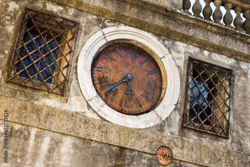 old clock on the wall of the house