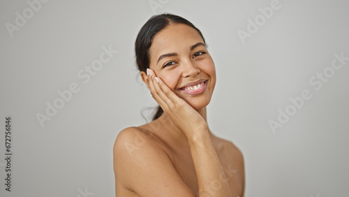 African american woman smiling confident standing shirtless over isolated white background