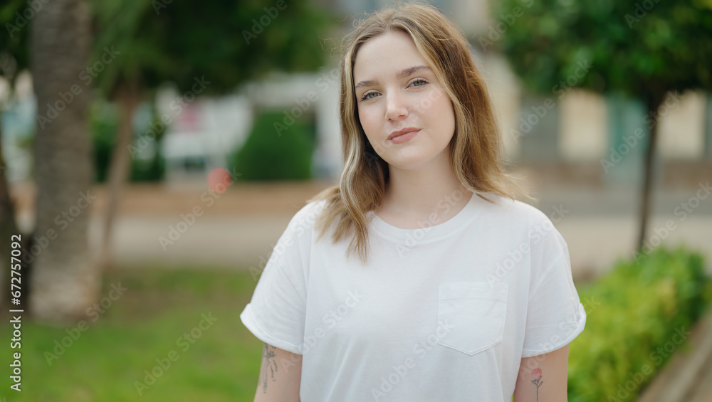 Young caucasian woman smiling confident standing at park Young caucasian woman smiling confident standing at park
