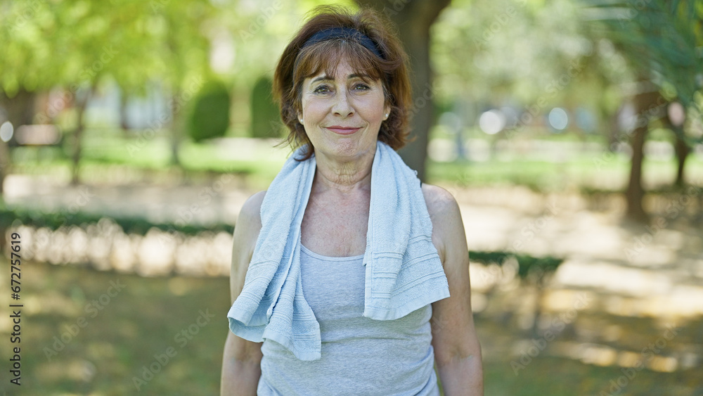 Middle age woman wearing sportswear smiling at park Middle age woman wearing sportswear smiling at park