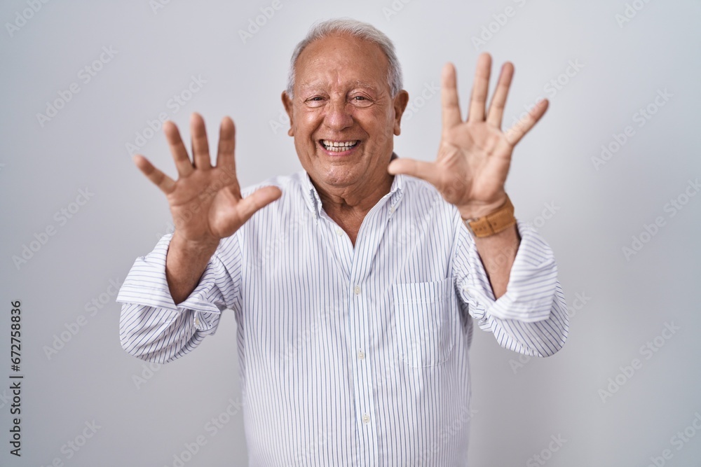 Senior man with grey hair standing over isolated background showing and pointing up with fingers number ten while smiling confident and happy. Senior man with grey hair standing over isolated background showing and pointing up with fingers number ten while smiling confident and happy.