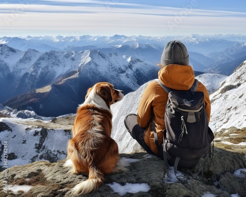 Travel companions travellers and dogs on a mountn top photo