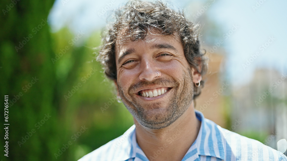 Young hispanic man smiling confident standing at street Young hispanic man smiling confident standing at street