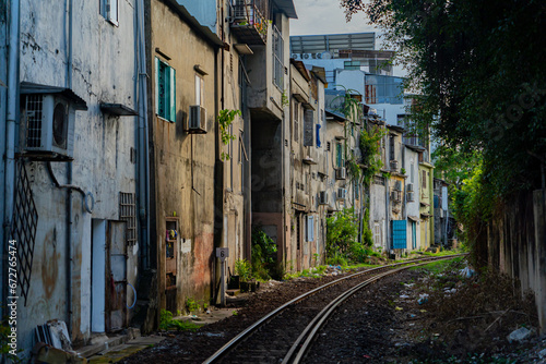 Street - railway.  A small street in Nha Trang in Vietnam with railway tracks running through the residential sector. © MASTERVIDEOSHAR