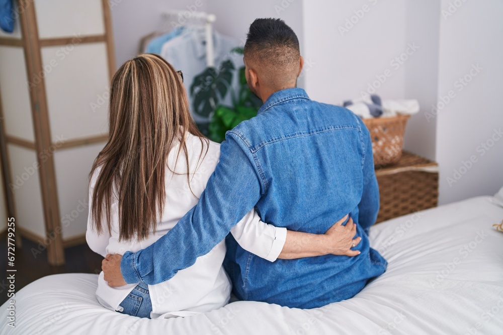 Man and woman mother and son hugging each other at bedroom